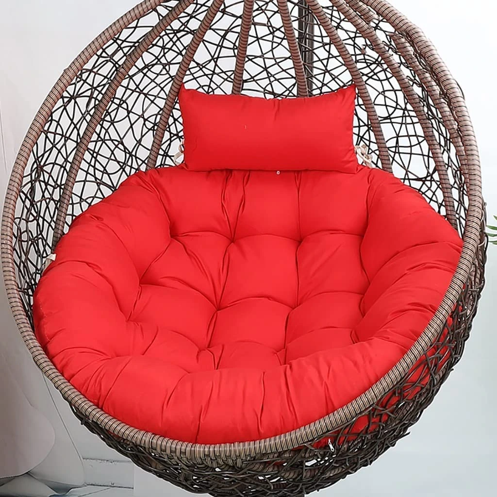 Red round cushion for balcony swing chair, microfiber filled, soft and durable for outdoor and indoor use – chair not included.