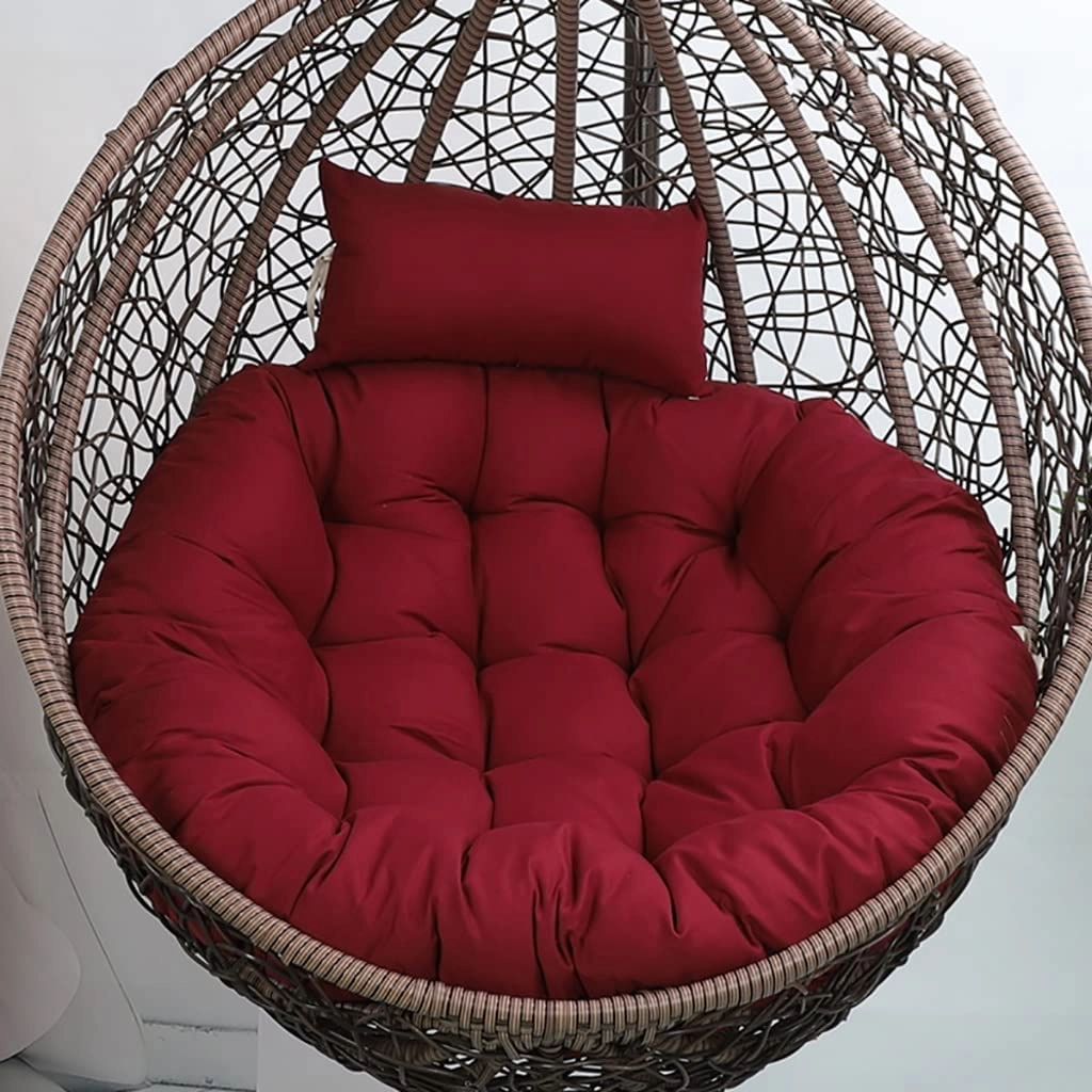 Cozy red round cushion for swing chair, adding comfort and a vibrant touch to indoor or outdoor seating